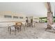Covered outdoor patio area with seating, perfect for community gatherings and relaxation at 7603 Taormina Way, Clermont, FL 34714