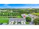Spacious townhomes featuring garage and street parking, a tranquil pond, green lawns and lush foliage at 812 Benoi Dr, Davenport, FL 33896