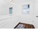 Bright bathroom featuring a white vanity with countertop, a window and dark floors at 812 Benoi Dr, Davenport, FL 33896