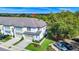 Charming townhome featuring well-maintained landscaping, a two-car garage and a private driveway at 812 Benoi Dr, Davenport, FL 33896