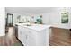 Bright open-concept kitchen with stainless steel appliances and white cabinetry at 812 Benoi Dr, Davenport, FL 33896