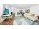 Bright living room featuring hardwood floors, neutral tones and modern furniture at 812 Benoi Dr, Davenport, FL 33896