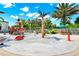 Bright splash pad with colorful pirate-themed water features and lush landscaping at 812 Benoi Dr, Davenport, FL 33896