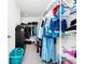Spacious walk-in closet with hanging racks, shelving and storage for organizing clothes at 812 Benoi Dr, Davenport, FL 33896
