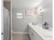 Bright bathroom featuring a double vanity, modern fixtures, and a shower with tiled walls at 945 Shawna Shrs, Haines City, FL 33844