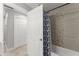 Neutral-toned bathroom with mosaic tiles, shower/tub combination, and plenty of storage space at 945 Shawna Shrs, Haines City, FL 33844