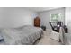 Simple bedroom with a bed, dresser, and a desk area perfect for a small office at 945 Shawna Shrs, Haines City, FL 33844