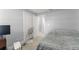 Basic bedroom with a bed and desk area near the entrance to the hallway at 945 Shawna Shrs, Haines City, FL 33844