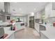 Bright kitchen with stainless steel appliances, custom white cabinetry, and a center island with seating at 945 Shawna Shrs, Haines City, FL 33844