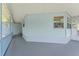 Covered patio provides ample space for outdoor relaxation and entertainment at 945 Shawna Shrs, Haines City, FL 33844