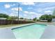 A backyard pool offers a refreshing escape, surrounded by a fence for privacy at 945 Shawna Shrs, Haines City, FL 33844