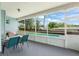 Covered sunroom with screen walls offering views of the fenced yard and refreshing pool area at 945 Shawna Shrs, Haines City, FL 33844