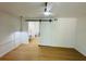 Bedroom with ceiling fan and a sliding barn door leading to the bathroom and vanity area at 1055 Kensington Park Dr # 205, Altamonte Springs, FL 32714