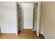 Walk-in closet with custom shelving and ample room for organization and storage at 1055 Kensington Park Dr # 205, Altamonte Springs, FL 32714