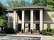 Attractive building with a covered entrance, columns, and well-manicured landscaping at 1055 Kensington Park Dr # 205, Altamonte Springs, FL 32714