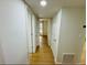 Hallway with hardwood floors and bright white walls at 1055 Kensington Park Dr # 205, Altamonte Springs, FL 32714