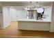 Bright open concept floor plan, with a view of the kitchen and quartz breakfast bar at 1055 Kensington Park Dr # 205, Altamonte Springs, FL 32714