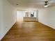Open living area with new floors, leading to a kitchen and front door at 1055 Kensington Park Dr # 205, Altamonte Springs, FL 32714