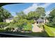 Aerial view of the community pool featuring a gazebo, outdoor seating and a landscaped yard at 1055 Kensington Park Dr # 205, Altamonte Springs, FL 32714