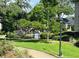 Community pool area surrounded by lush landscaping and a secure fence at 1055 Kensington Park Dr # 205, Altamonte Springs, FL 32714