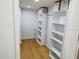 Spacious walk-in closet with custom shelving and plenty of storage at 1055 Kensington Park Dr # 205, Altamonte Springs, FL 32714