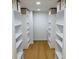 Walk-in closet with custom shelving at 1055 Kensington Park Dr # 205, Altamonte Springs, FL 32714