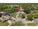 Aerial shot of the property highlighting its location in a cul-de-sac within a neighborhood near a lake at 10708 Brice Ct, Orlando, FL 32817