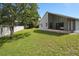 Spacious backyard featuring a well-maintained lawn, privacy fence, and mature trees, perfect for outdoor activities at 10708 Brice Ct, Orlando, FL 32817