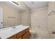 Bathroom with a tub shower combo, single sink vanity, and tiled floors at 10708 Brice Ct, Orlando, FL 32817