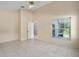 Spacious bedroom featuring tile floors, neutral walls, and natural light from window at 10708 Brice Ct, Orlando, FL 32817