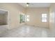 Large bedroom with tile floors, natural light, and ample space for furnishings at 10708 Brice Ct, Orlando, FL 32817