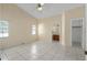 Large bedroom featuring tile floors, ceiling fan, closet, and ensuite bath at 10708 Brice Ct, Orlando, FL 32817