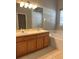 Bright bathroom features double sinks, a large mirror, and a soaking tub at 109 Belgian Way, Sanford, FL 32773