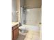 Neutral bathroom features a tiled shower over tub and updated vanity at 109 Belgian Way, Sanford, FL 32773