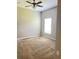 Neutral bedroom with ceiling fan and natural light at 109 Belgian Way, Sanford, FL 32773