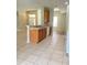Open concept kitchen with wood cabinets overlooking a large living space at 109 Belgian Way, Sanford, FL 32773