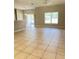 Bright open-concept living space with neutral walls and tile floors at 109 Belgian Way, Sanford, FL 32773