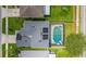 Aerial view of a home with a screened-in pool and solar panels on the roof at 1224 Blackwater Pond Dr, Orlando, FL 32828
