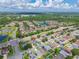 A serene aerial view highlights the property's proximity to a pond, lush green spaces, and a well-maintained community at 1224 Blackwater Pond Dr, Orlando, FL 32828