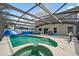 Spacious backyard featuring a screened-in pool, outdoor seating, and a relaxing atmosphere at 1224 Blackwater Pond Dr, Orlando, FL 32828