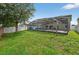 A vast green backyard featuring a screened in pool, great for entertainment at 1224 Blackwater Pond Dr, Orlando, FL 32828