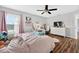 Cozy bedroom with a large window, plush bedding, and soft lighting at 1224 Blackwater Pond Dr, Orlando, FL 32828