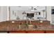 Close-up of the sink and granite countertops with the living room visible in the background at 1224 Blackwater Pond Dr, Orlando, FL 32828