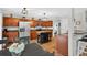 Spacious kitchen with an island, stainless steel refrigerator, and warm wood cabinetry at 1224 Blackwater Pond Dr, Orlando, FL 32828