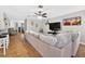 Bright and airy living room with a large sectional, tile flooring, and open layout at 1224 Blackwater Pond Dr, Orlando, FL 32828