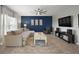 Stylish living room showcases a bold accent wall, modern furniture, and a cozy ambiance at 1292 Cavender Creek Rd, Minneola, FL 34715