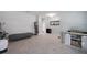 Spacious living area featuring tiled floors, a modern console with storage, and neutral decor at 1292 Cavender Creek Rd, Minneola, FL 34715