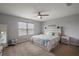Serene main bedroom offers a relaxing retreat with soft lighting, neutral tones, and cozy decor at 1292 Cavender Creek Rd, Minneola, FL 34715