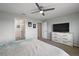 Cozy main bedroom featuring a ceiling fan, ensuite bath and neutral decor at 1292 Cavender Creek Rd, Minneola, FL 34715