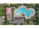 Overhead shot of the community pool highlighting the unique shape, lounge chairs, and playground area at 1292 Cavender Creek Rd, Minneola, FL 34715